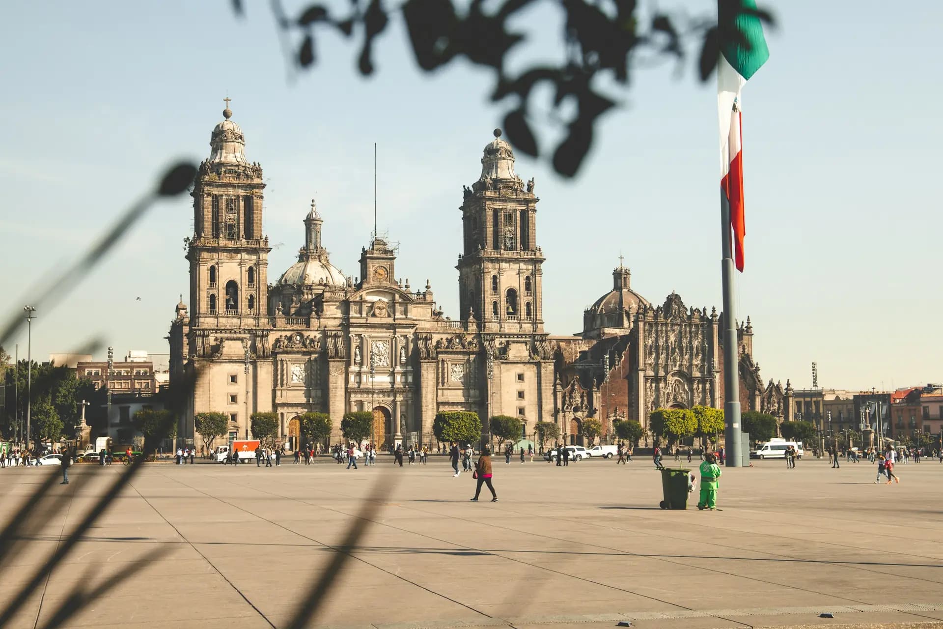 A historic cathedral beside a wide public square in Mexico